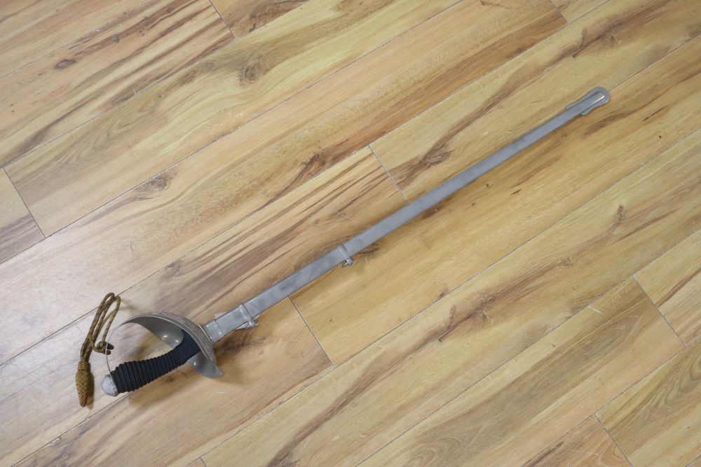 An officers sword, shagreen grip and 88cm etched, single-edged blade, in scabbard